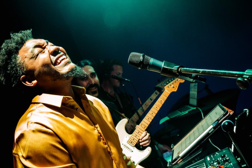 a man singing into a microphone